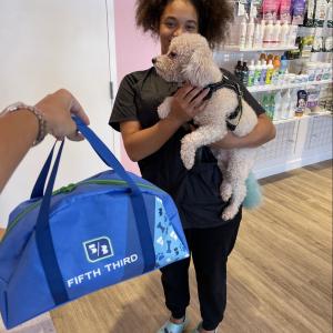 A pet owner holding their dog