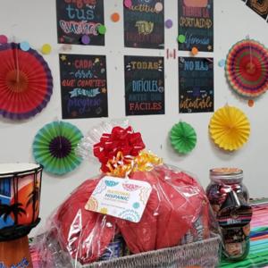 a shirink wrapped gift bag on a table with colorful drum and other decorations
