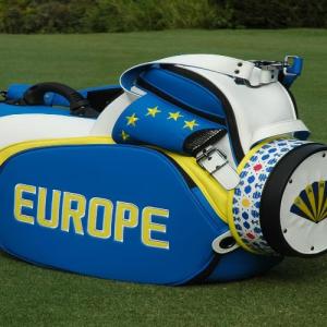 Golf club bag on its side on green grass. "Europe" on the side.