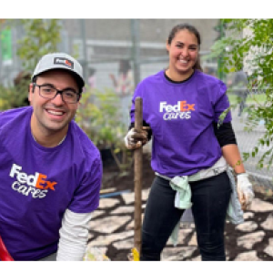 Two volunteers with shovels.