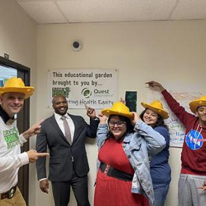students being silly wearing straw hats