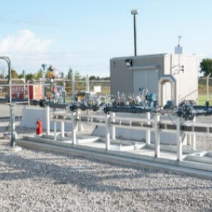 exterior energy building with industrial piping and gravel ground covering