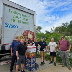 group photo in front of Sysco truck