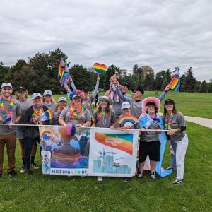 group picture with rainbow flags