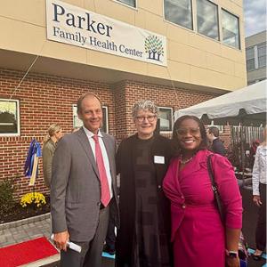 3 people stand for a photo