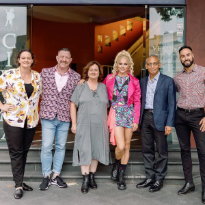 Group of people posing outside