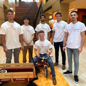 Volunteers posed by finished bike and wagon.