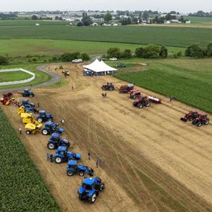 Aerial view of tractors and a tent