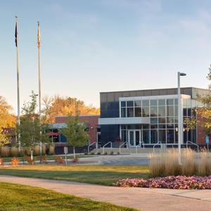 Exterior view of Hormel headquarters, three flag poles in front.