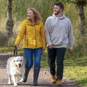 Family out walking dog