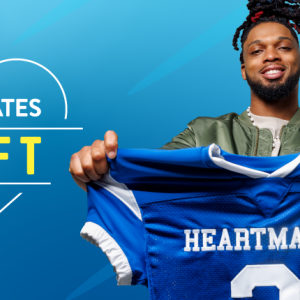 Damar Hamlin holding a blue "Heartmates" football jersey.
