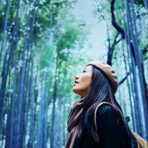 woman in a beret in a forest