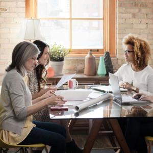 4 people sitting at a meeting