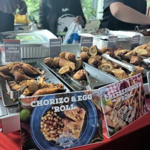 Various foods in metal trays on a table
