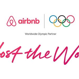 AirBnB logo and Olympic rings above "Host the World".