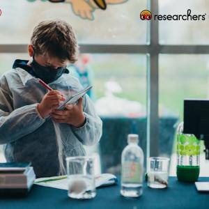 Student in front of lab equipment