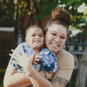 Woman giving a child a hug