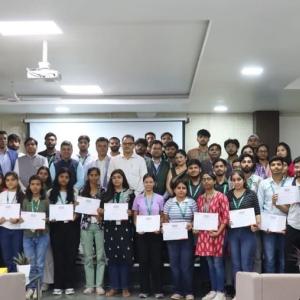 students holding up their certificates