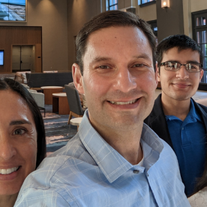 Martin Holguin, his wife and two children.