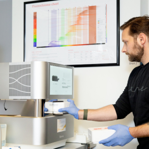 Stephen Gire in the lab with the Illumina NextSeq 2000 | Photo: Angela DeCenzo