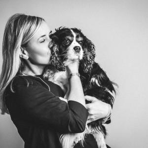 Jutta and pet dog embracing cuddle