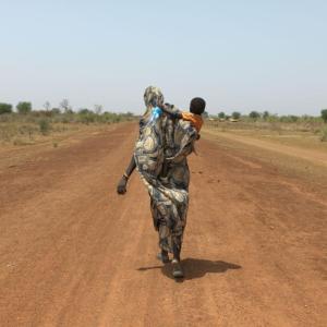 Mothers like Nyibol Mathiang Deng are forced to trek miles to reach safety.