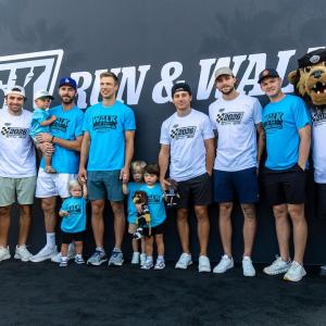 LA Kings players, community members and Bailey pose for a group photo during the 2026 LA Kings 5K, showing support for Kings Care Foundation and its community impact initiatives across Los Angeles.