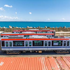 subway cars with ocean in background 