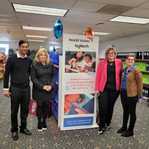 the logitech and World Vision team pose together 