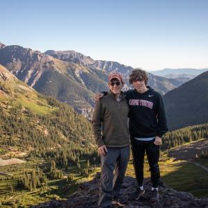 John Mulcahy and family member posed in a scenic natural area.