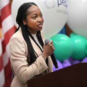 A person talking into a microphone 