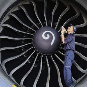 person inspecting a machine