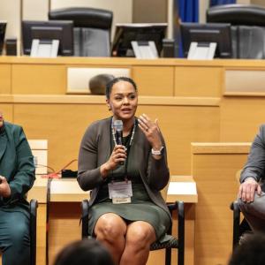 Three people presenting to a group