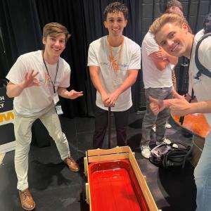Volunteers posed by a finished wagon.