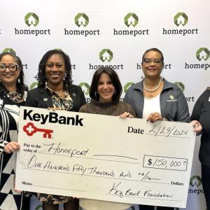 People standing together with check from KeyBank