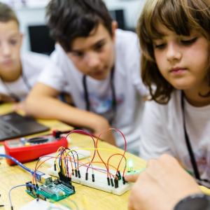 students working on a circuit board