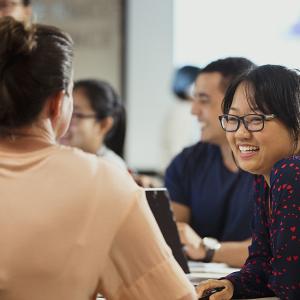 group of people talking and smiling