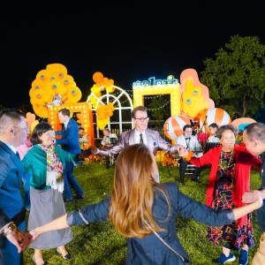 people holding hands in a circle