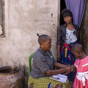 Janet checks Eliciana’s progress.
