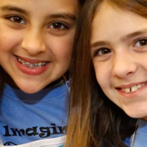 three girls smiling