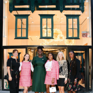 A group of six women outside a kate spade store