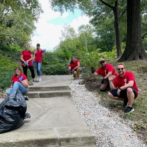 KeyBank volunteers clean a historic park.