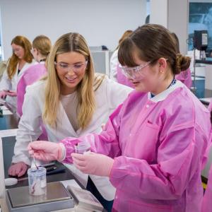 People in a lab making lipgloss