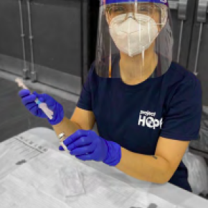 person wearing protective equipment in laboratory
