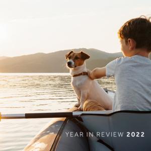 Child with dog in a kayak