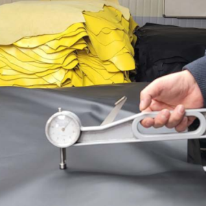 Trained quality inspectors measuring leather thickness, 