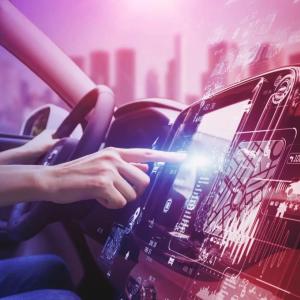 person using a console while driving