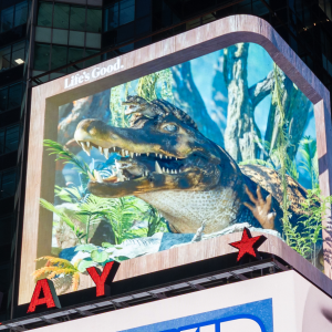 Lit billboard showing a crocodile