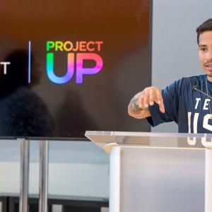 Victor Montalvo speaking at a podium