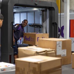 FedEx packages on conveyor belt
